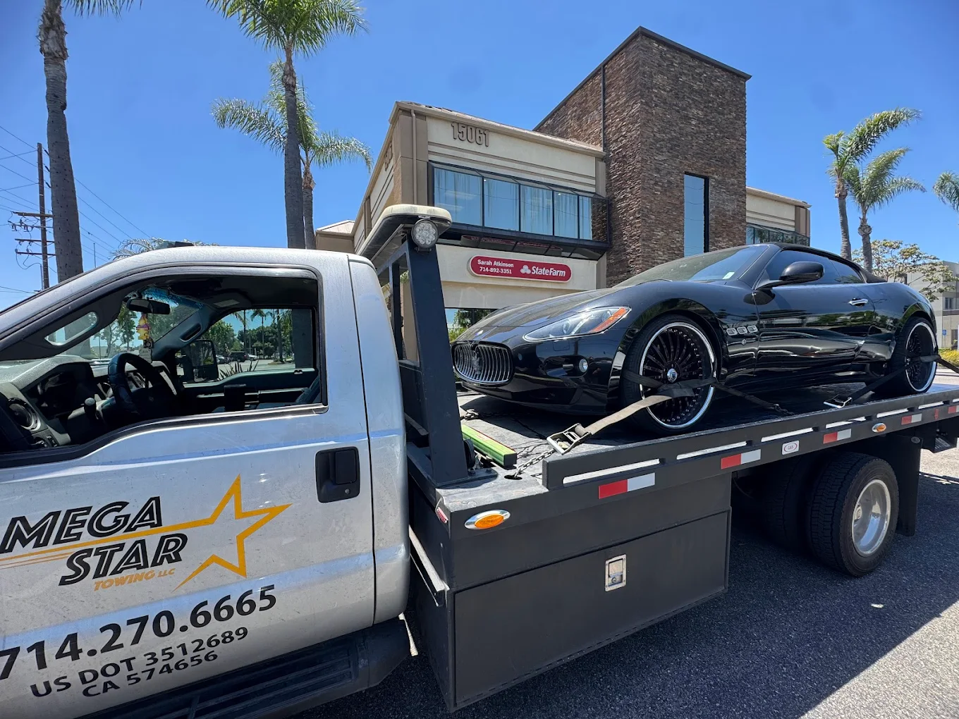 Home 6 Megastar Towing tow truck assisting driver in Anaheim, CA