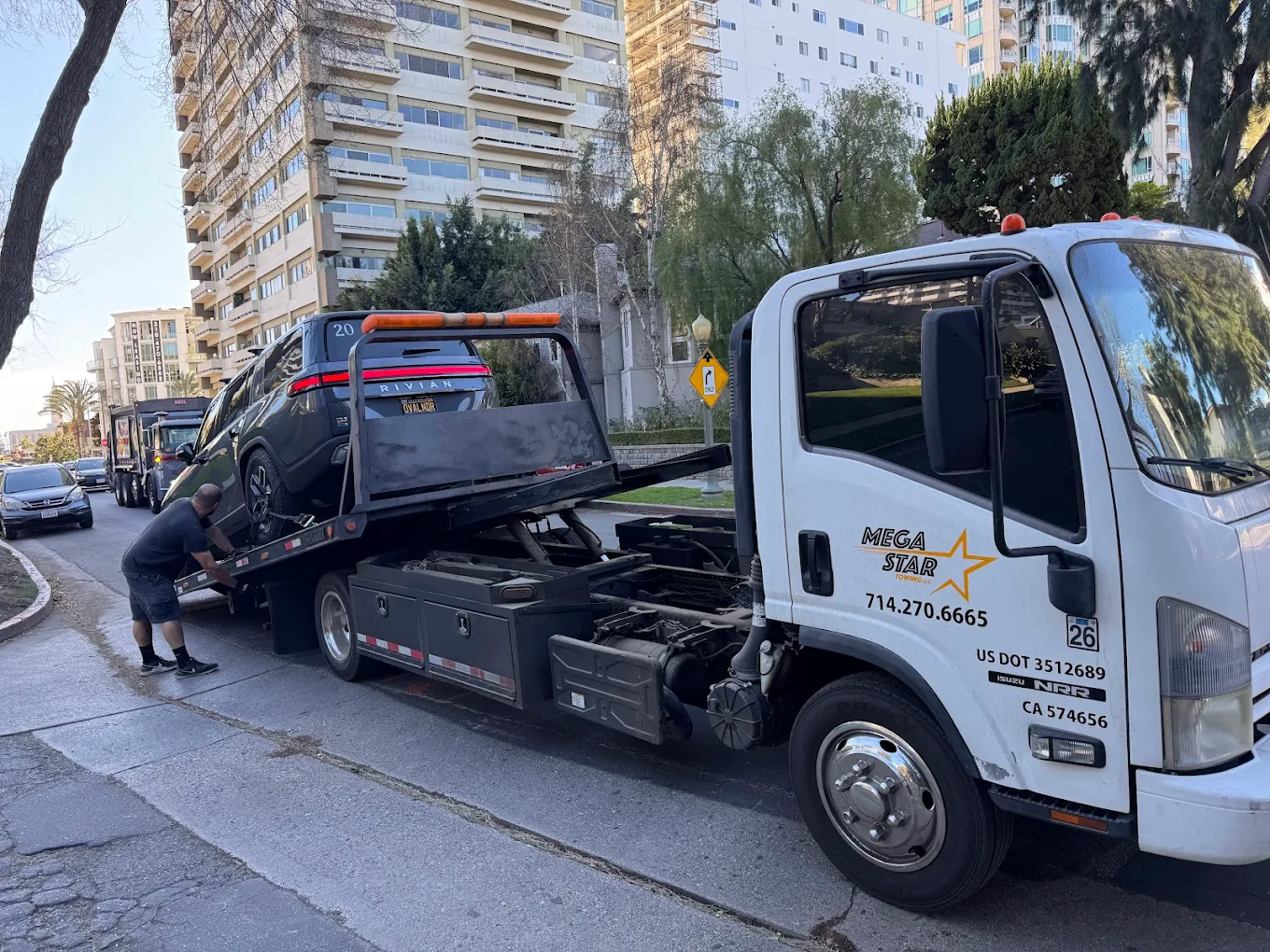 Home 7 Megastar Towing Truck loading vehicle in Anaheim California